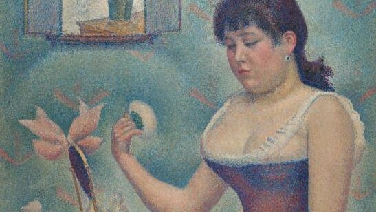 Woman sitting down with powder and mirror